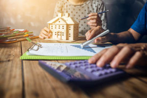 illinois home owner calculating repair costs from home inspection