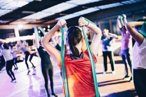 group of people exercising with elastic bands