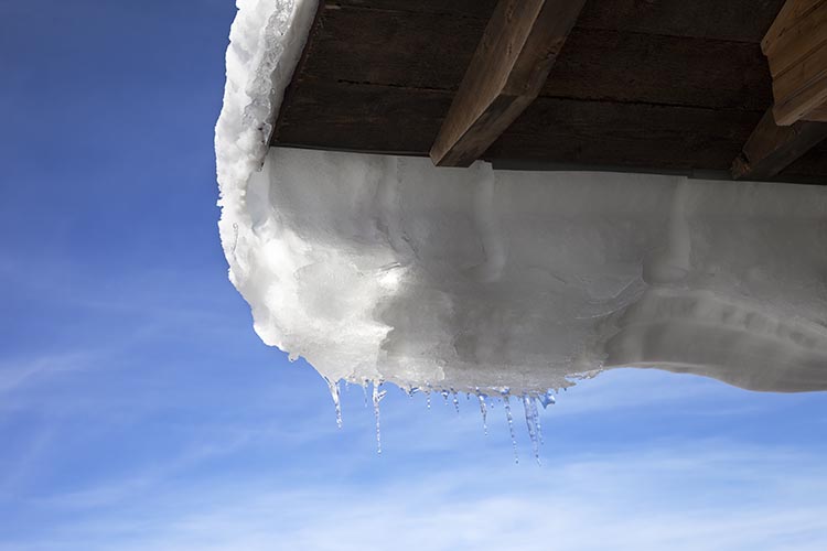 snow-coming-off-a-roof